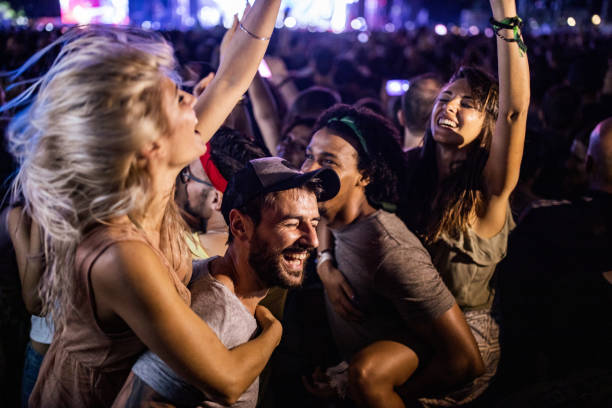 istock Carefree couples having fun while dancing on music festival. 1162124211