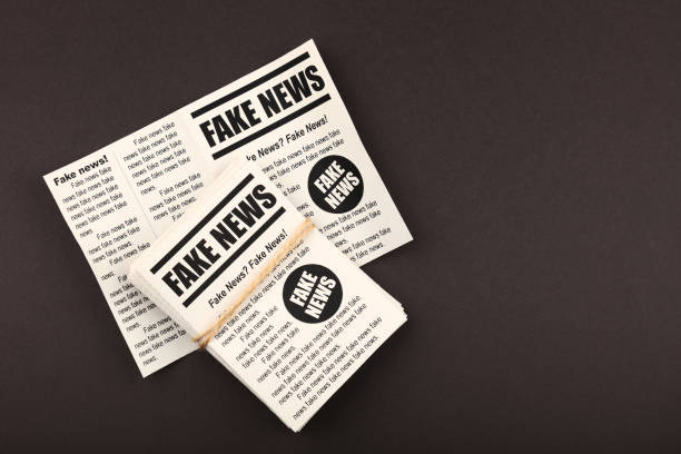 istock Stack of FAKE NEWS newspapers over black 1162124214