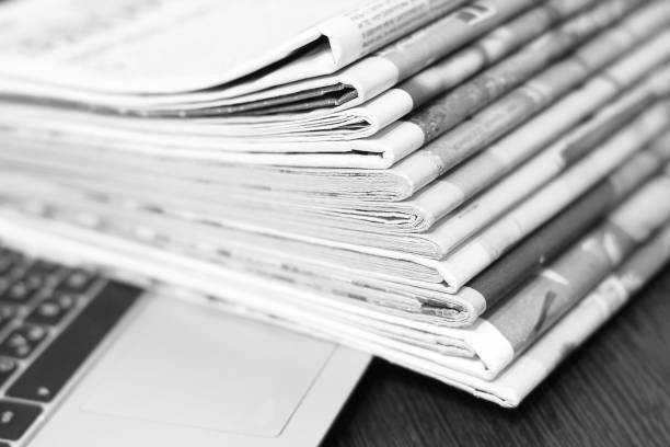 istock Newspapers and Laptop 1162124260