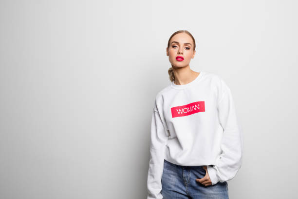istock Confident beautiful woman in a white blouse 1162124485