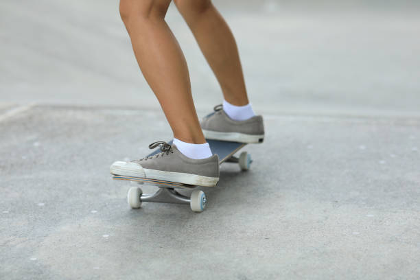 istock Female skateboarder skateboarding at skatepark 1162125837
