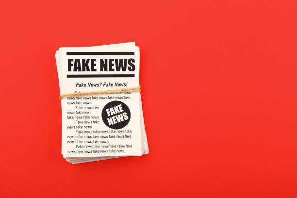 istock Stack of FAKE NEWS newspapers over red 1162127112