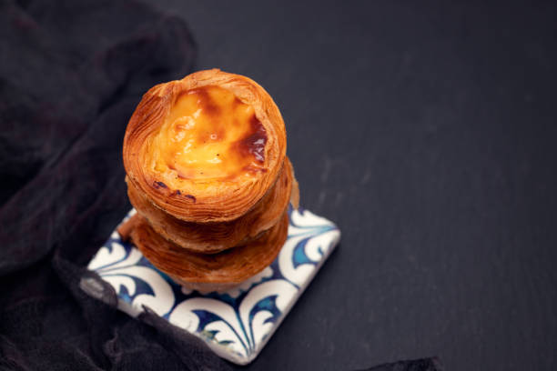 istock portuguese egg tart pastel de nata on black ceramic background 1162127118