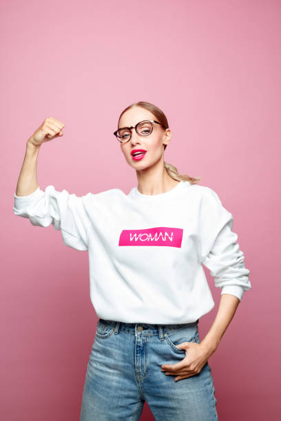 istock Smiling friendly woman raising fist 1162127151