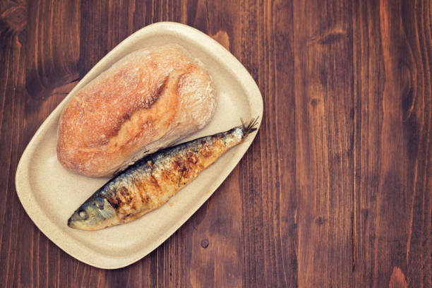 istock grilled sardine with bread on dish 1162127162