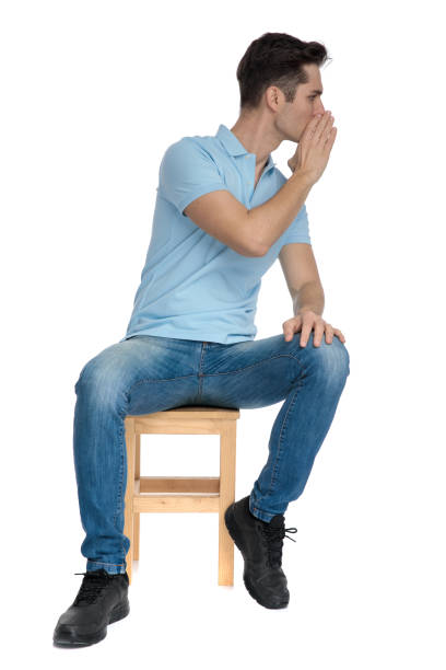 istock Handsome casual guy covering his mouth and whispering 1162127288