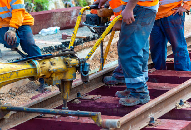 istock Railway workers bolting track rail 1162128052