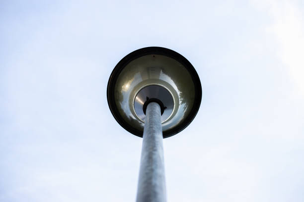 City lamp on a pole – Vintage public street light used to enlighten the streets at night
