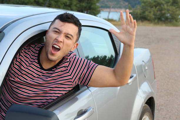 istock Angry young man driving a car 1162129640