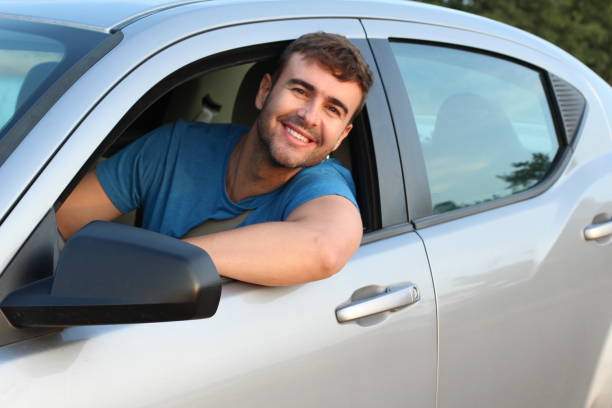 istock Gorgeous male driver smiling portrait 1162129654