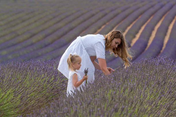 istock Mother with daughter in lavender field 1162129886