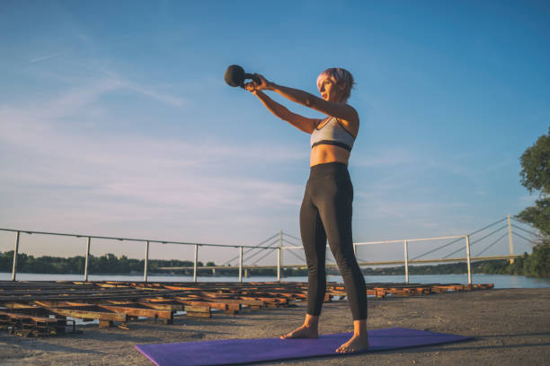 istock Woman exercising pilates outdoor 1162130691