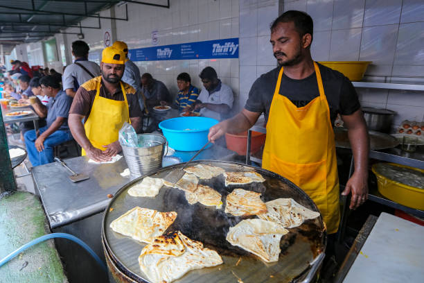 Transfer Road Roti Canai Pulau Pinang, Malaysia - July 05, 2019 : The famous roti canai with chicken and beef curry stall at Transfer Road. One of tourist attraction and the best place to breakfast in Penang. roti canai stock pictures, royalty-free photos & images