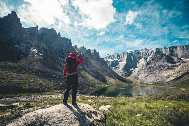 istock Woman hiker hiking on high altitude mountains 1162130918