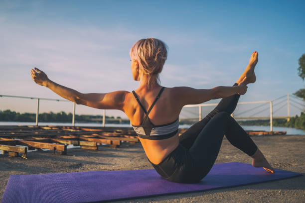 istock Woman exercising pilates outdoor 1162130951