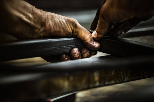 istock Close up of unrecognizable worker working with iron. 1162131668
