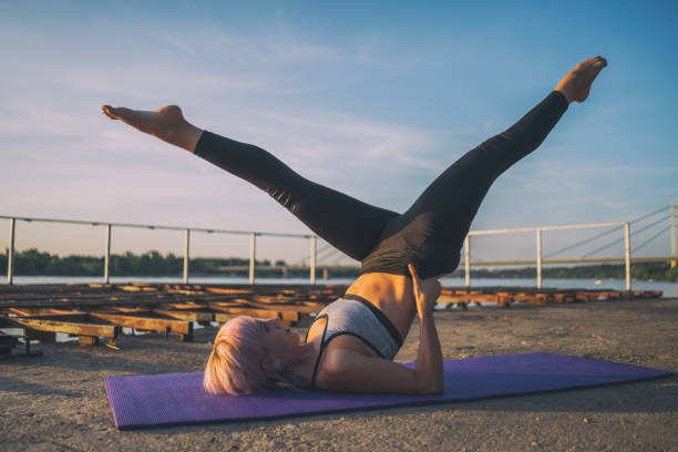 istock Woman exercising pilates outdoor 1162132138