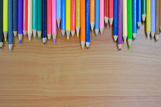 istock Directly Above View Of Colored Pencils On Wooden Table 1162132521
