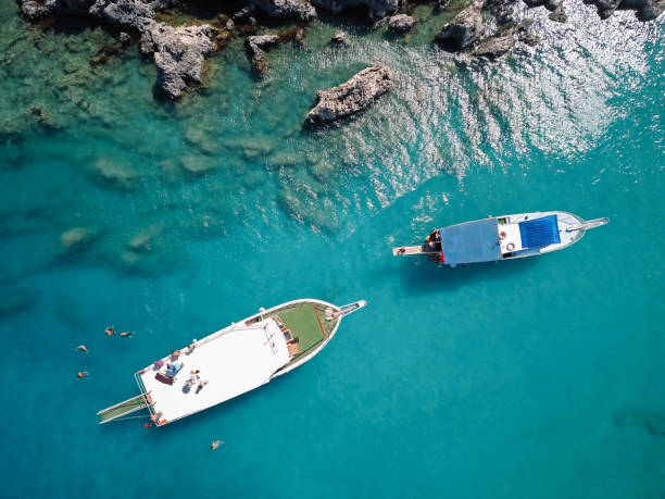 Yacht on turquoise beach stock photo