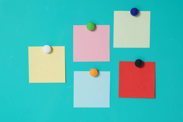 istock Close-Up Of Colored Adhesive Notes Over Blue Background 1162133684