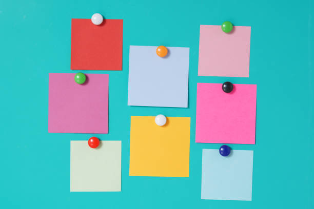 istock Close-Up Of Colored Adhesive Notes Over Blue Background 1162133685