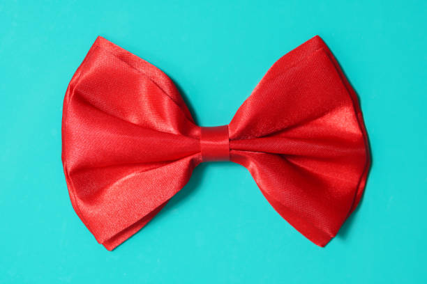 istock Close-Up Of Red Bow On Blue Background 1162133689