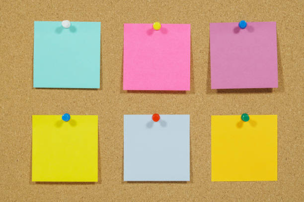 istock Close-Up Of Colored Adhesive Notes Over Brown Background 1162135623