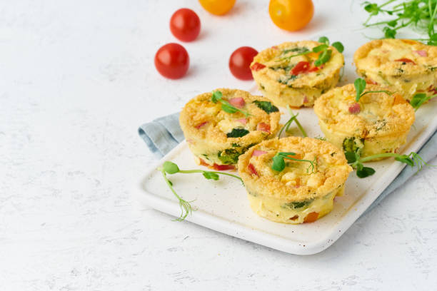 istock omelet with tomatoes and bacon, baked eggs with spinach and broccoli, closeup with copy space, keto, ketogenic diet 1162136861