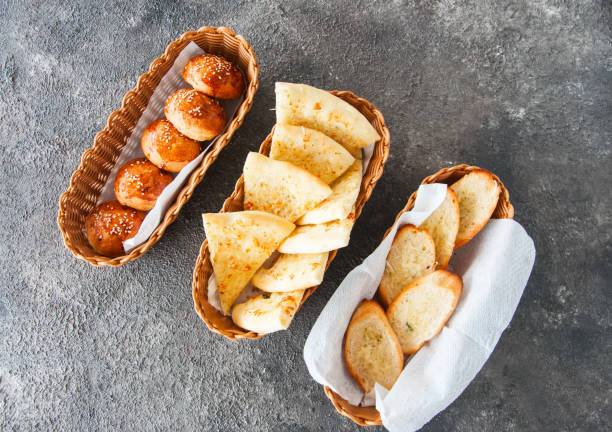 istock Variety bread snacks in a basket. Top view. 1162137165