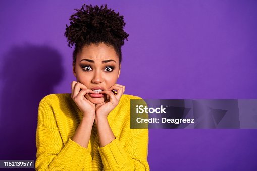 istock Portrait of terrified beautiful youth nails bite hear horrible news wear stylish trendy pullover jumper isolated over purple violet background 1162139577
