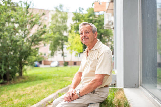 istock Senior man sitting outdoors 1162139686