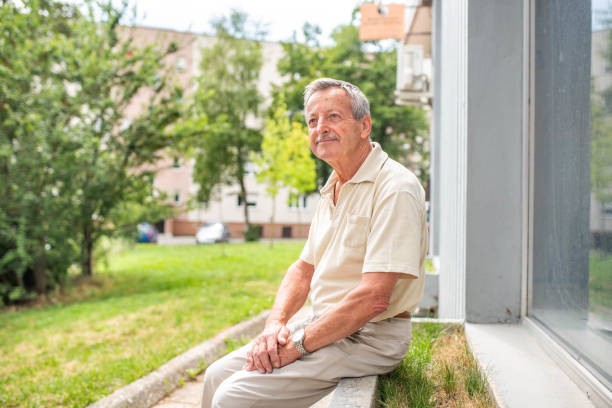 istock Senior man sitting outdoors 1162139696