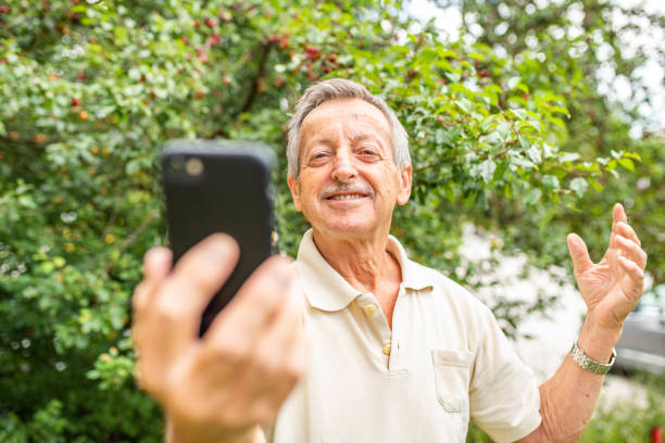 istock Senior man taking a selfie with mobile phone 1162139735