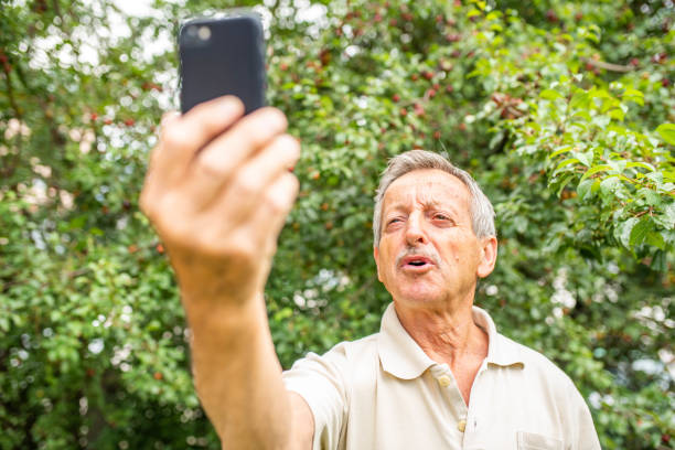 istock Senior man taking a selfie with mobile phone 1162139740