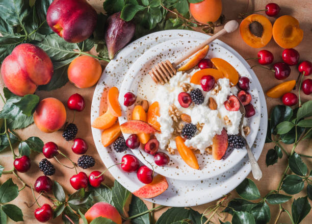 Italian ricotta cheese or cottage cheese with fruits. Cottage cheese with fruits, berries, honey and nuts. Italian ricotta cheese with fruits copy space directly above. cottage cheese photos stock pictures, royalty-free photos & images