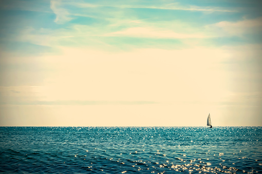 sailboat at the horizon retro background