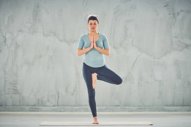 istock Woman doing yoga. 1162143970