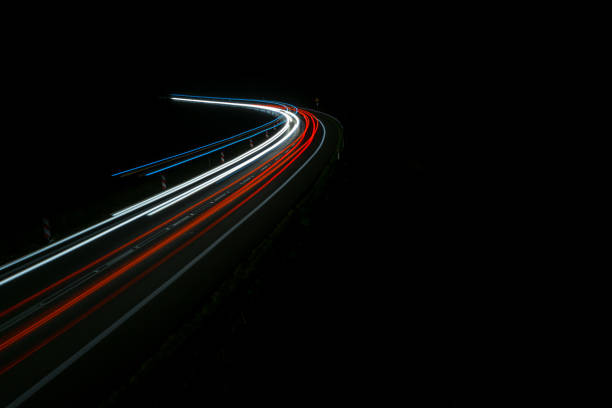 istock lights of cars with night 1162144475