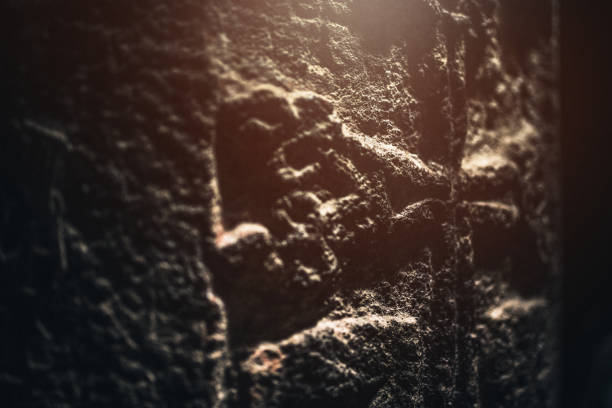 Aged cross ornament close-up.