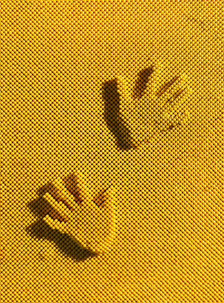 close up black and colorful handprints over white