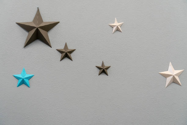 istock Brown, blue and beige stars on a gray background. Texture. Background. copy space. 1162145337