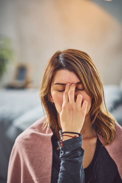 istock Woman doing breathing exercises in bedroom. 1162145754