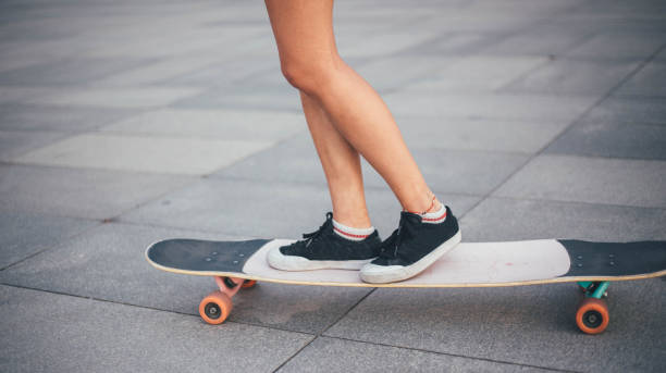 istock Woman with skateboard 1162147241