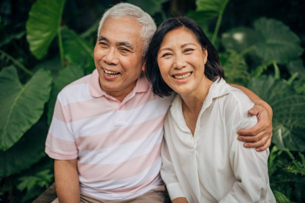 istock Charming senior couple relaxing in park 1162147920