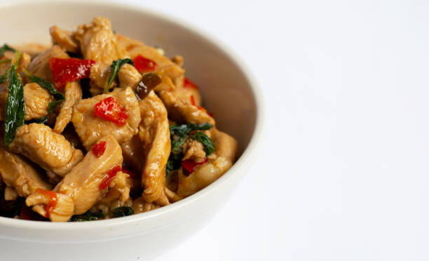 istock Stir-fried chicken with holy basil on white 1162148139