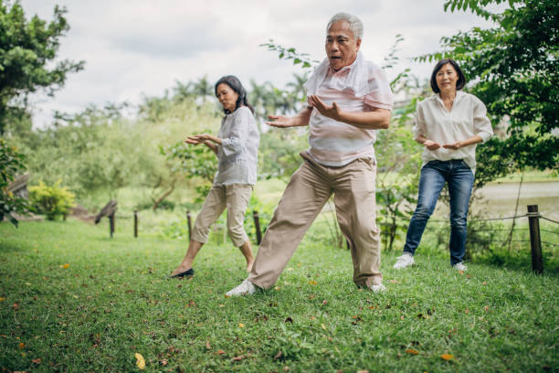 istock Three senior friends exercising in park 1162149782