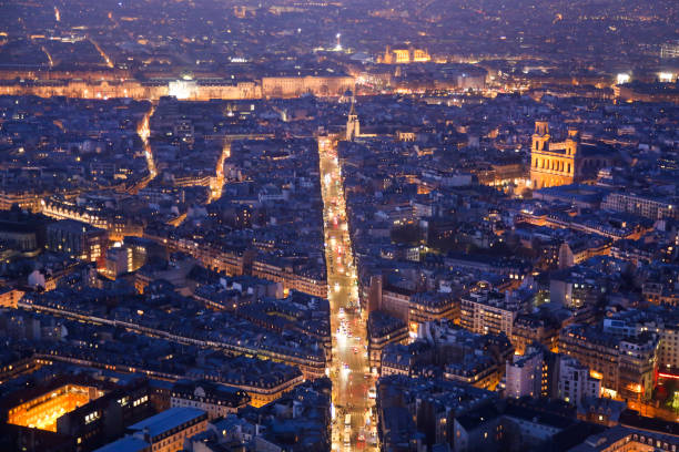 Paris at night High angle view of Paris, France at dusk - Rue de Rennes and church Saint Sulpice. luxembourg paris stock pictures, royalty-free photos & images