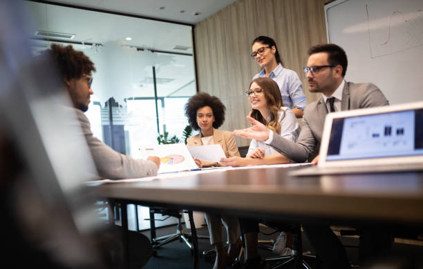 istock Group of successful business people at work in office 1162151923