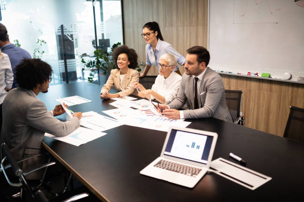 istock Group of successful business people at work in office 1162151930