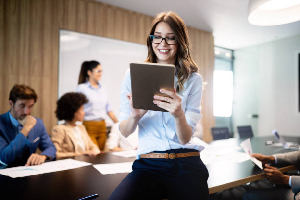 istock Successful business group of people at work in office 1162151945